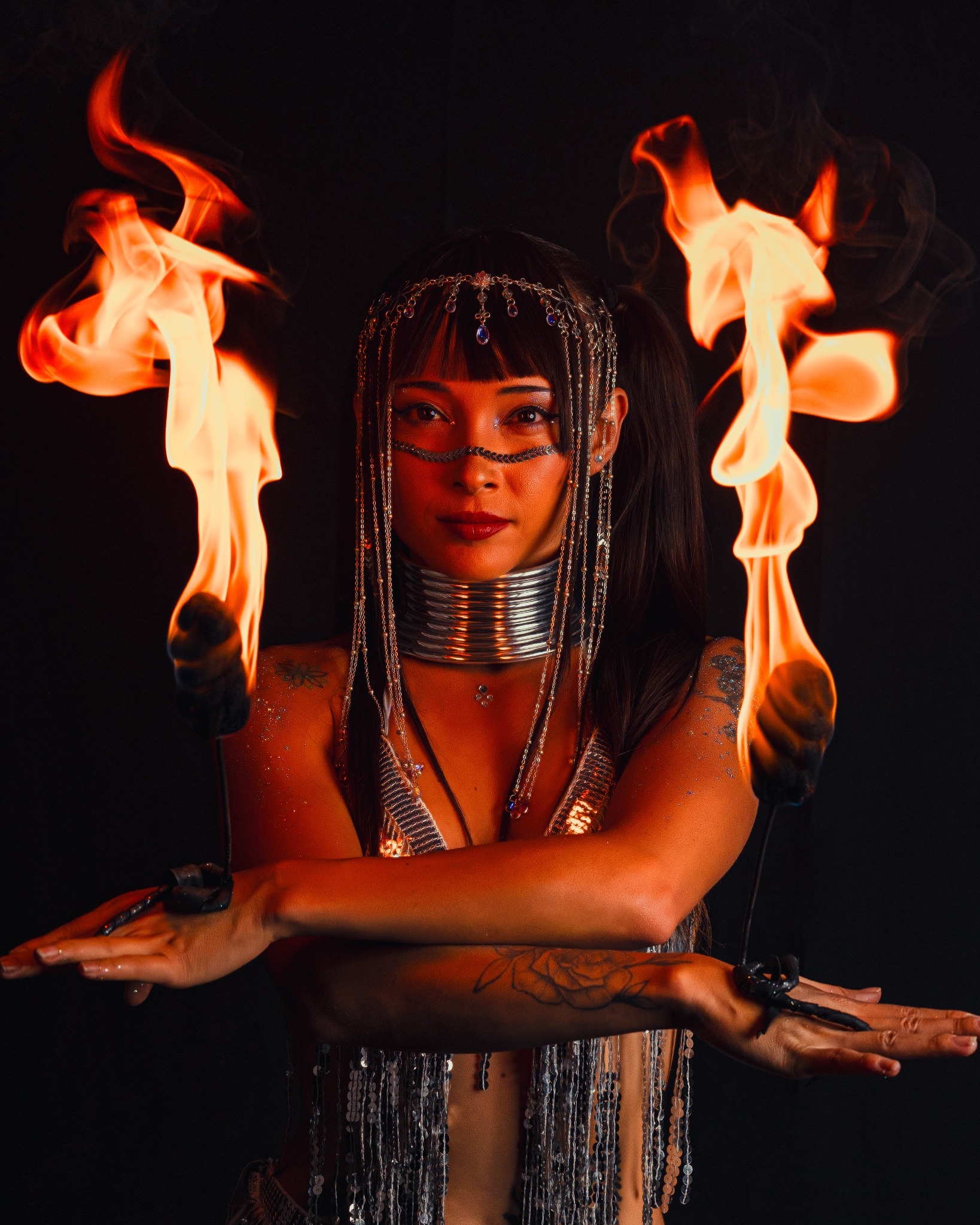 Portrait of JAWARA with fire hands beside her face